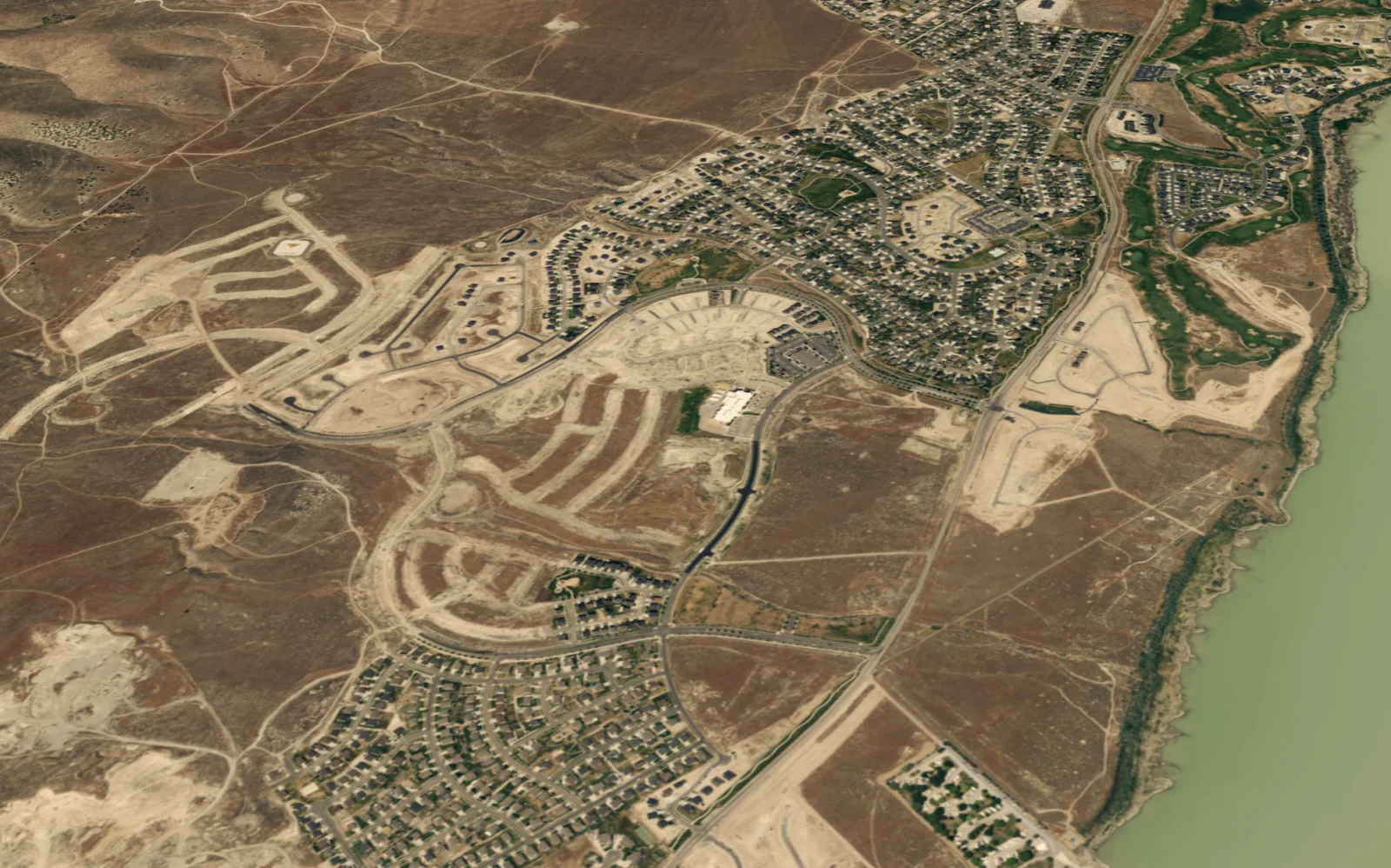 The same ground in 2017, mostly raw desert with graded pads