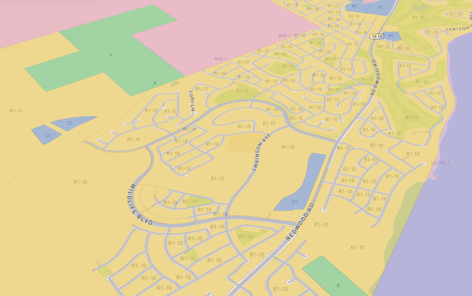Zoning districts painted across a lakeside suburb, labelled R1-10, CC, MF-10 and A